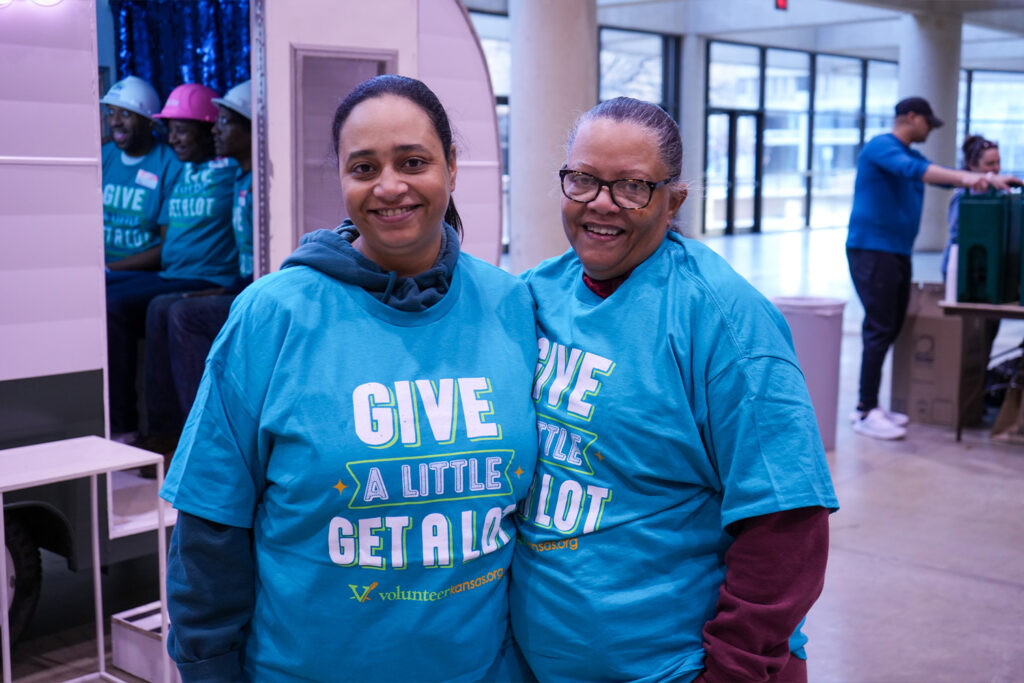 Family partner Lovetta and her daughter smiling together at the MLK Day of Service event.