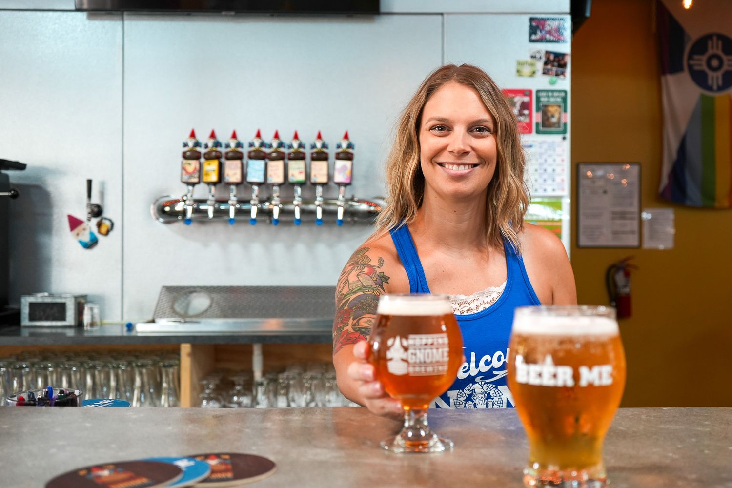 Bartender serving a beer.