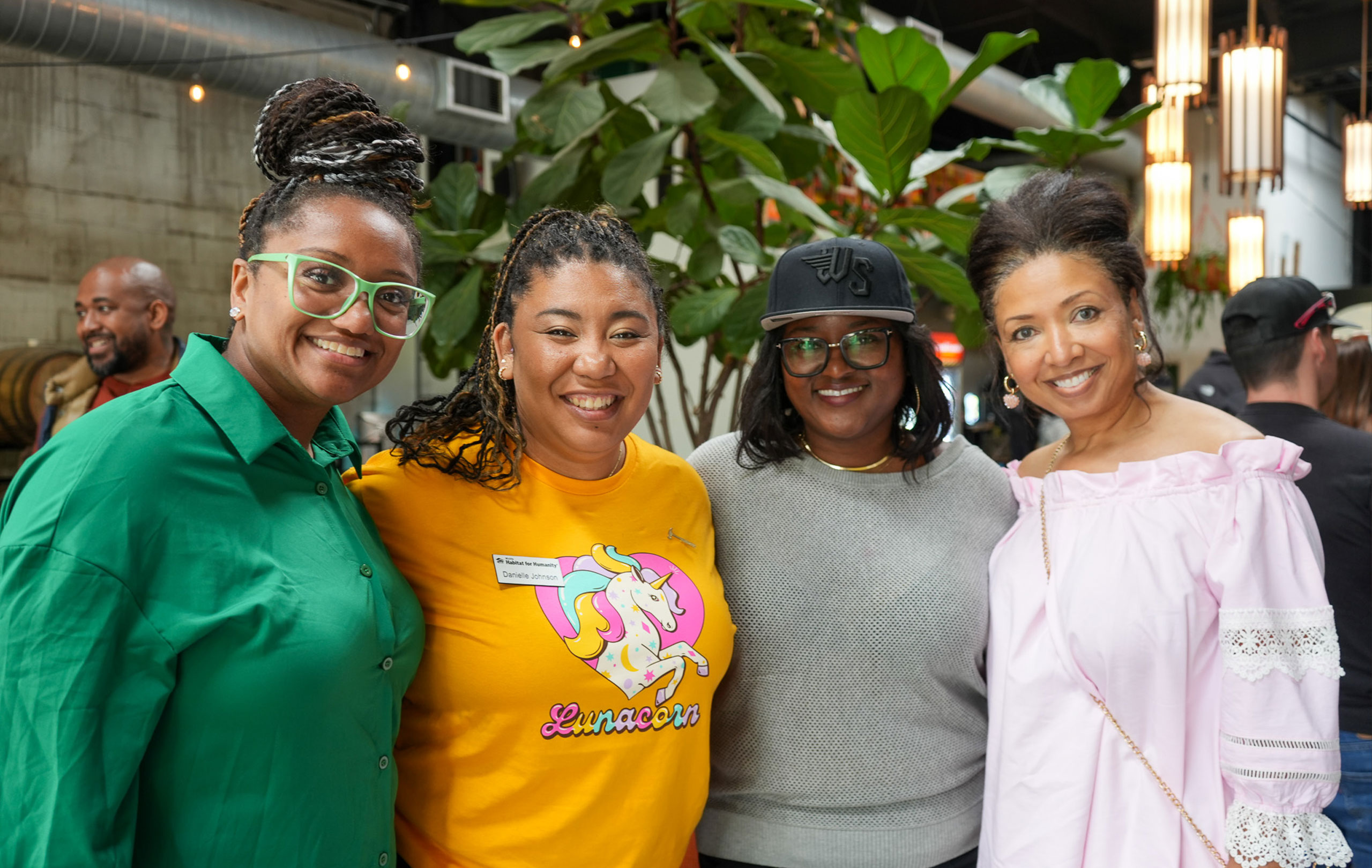 A group of women smiling together.