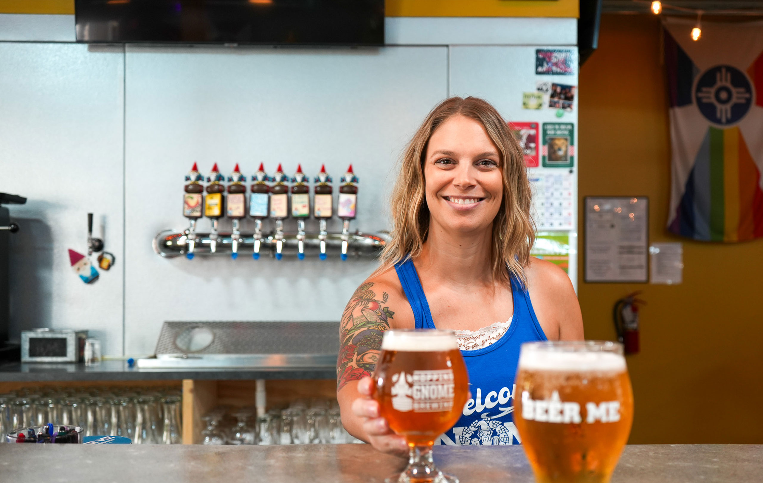 Bartender serving a beer.