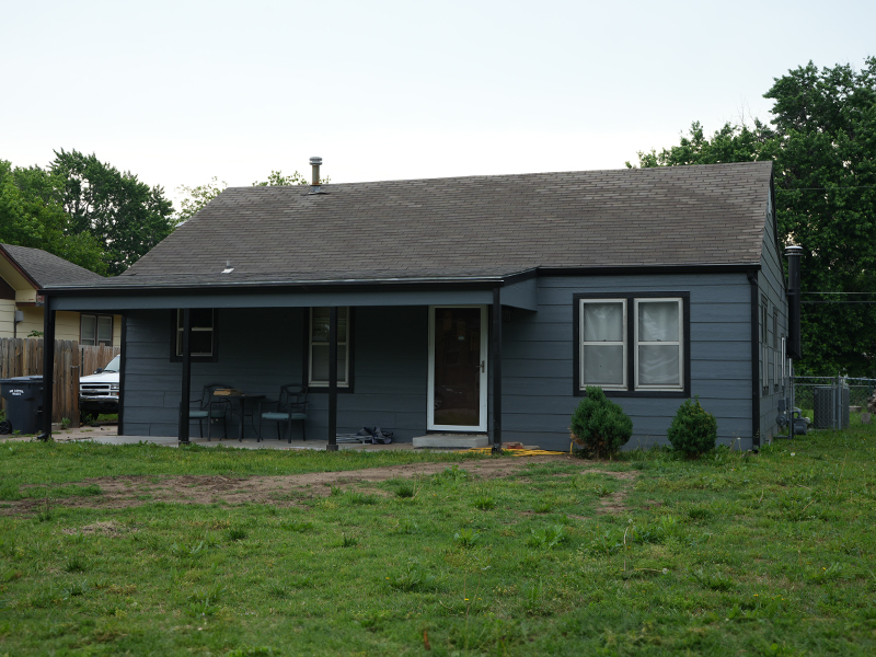 A house with its brand-new and completed siding.