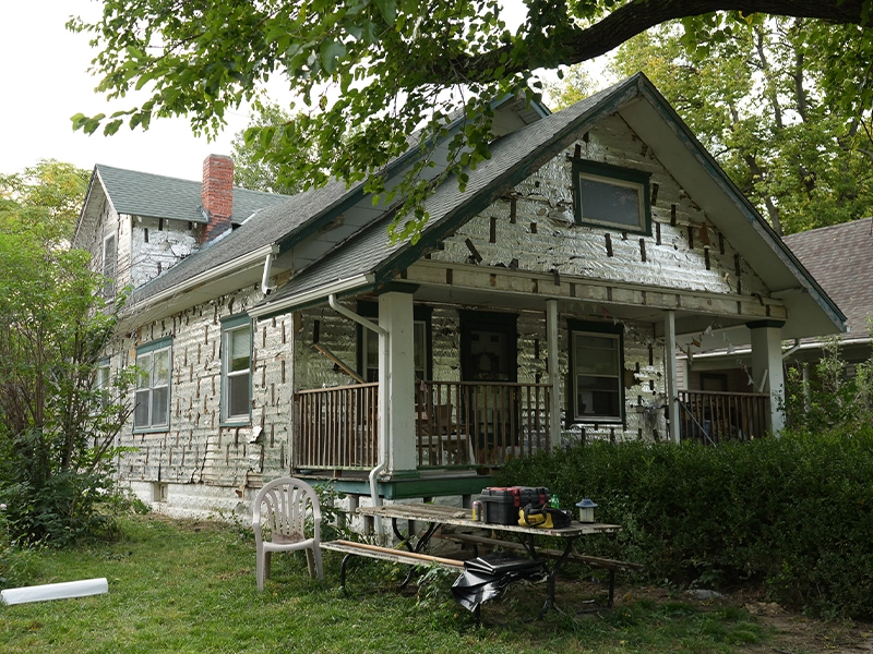 A home removed of its siding.