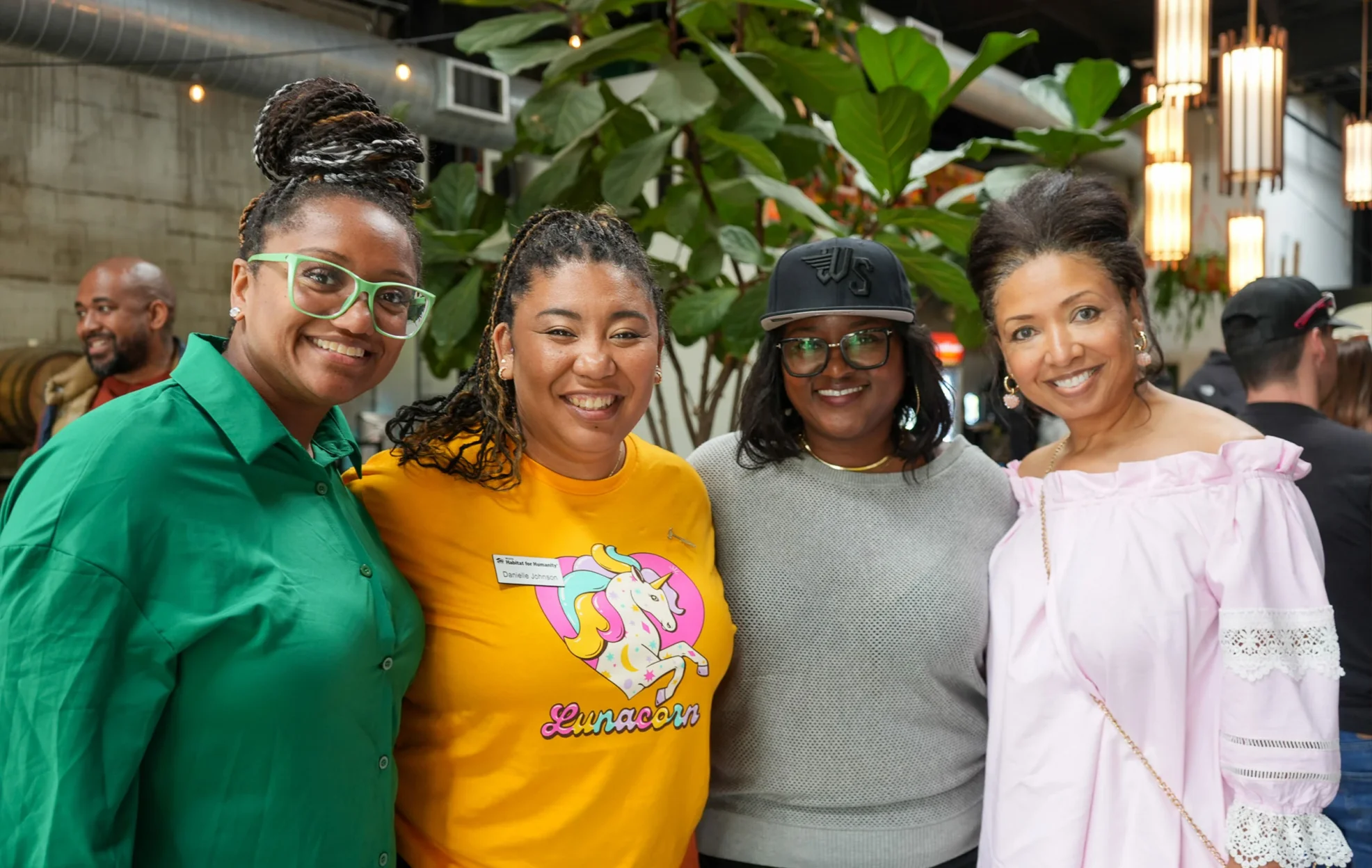 A group of women smiling together.